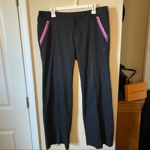 Y2K low rise Nike flair leg track pants with pink satin trimmed pockets